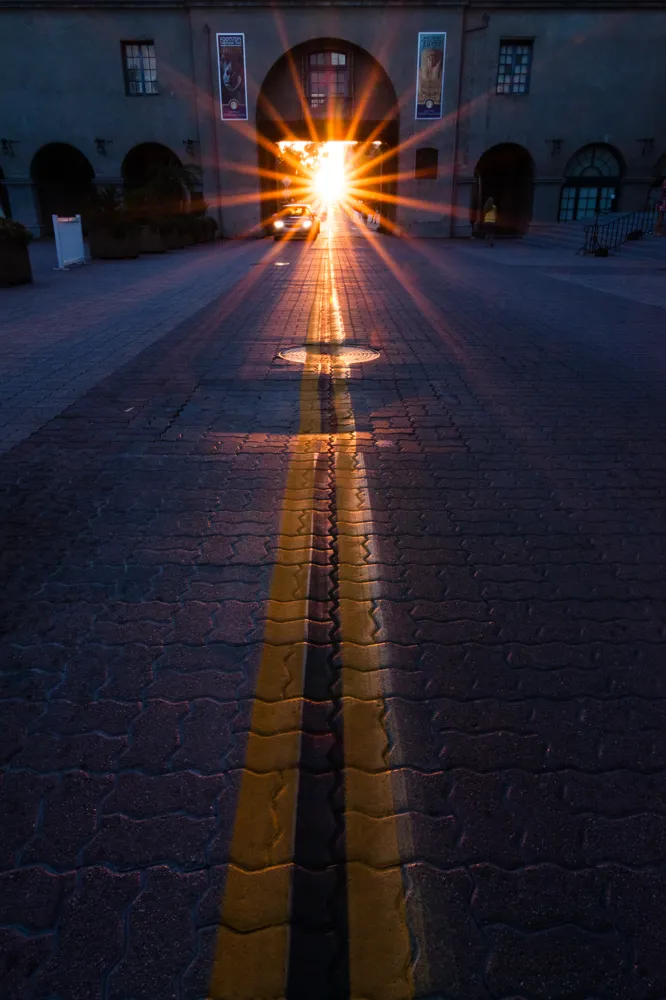 Sunset on the first day of autumn, looking down the Cabrillo Bridge from the courtyard in front of the Museum of Man in Balboa Park