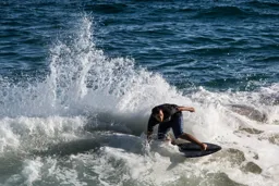 Skimboarding at Divorce Beach